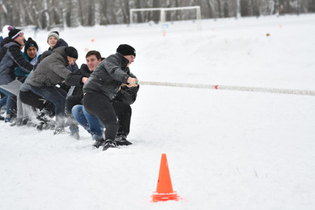 Orenburg, Russia-January 26, 2017 year: Students compete in the tug-of-war in the winter games, dedicated to Day studentsのeditorial素材