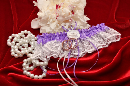 Two wedding rings for bride and groom and Peony flower.の写真素材