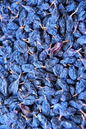 Strain raisins for making homemade red wineの写真素材