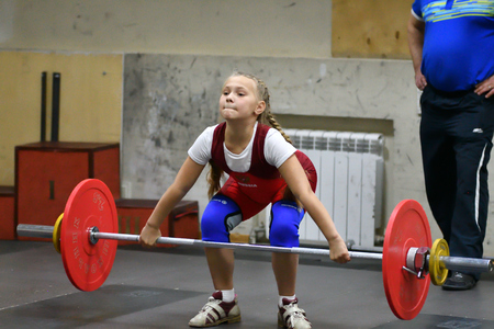 Orenburg, Russia, December 16, 2017 years: the girls compete in weightlifting at the Championship field on weightlifting and Cupのeditorial素材
