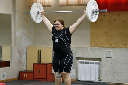 Orenburg, Russia, December 16, 2017 years: the girls compete in weightlifting at the Championship field on weightlifting and Cupのeditorial素材