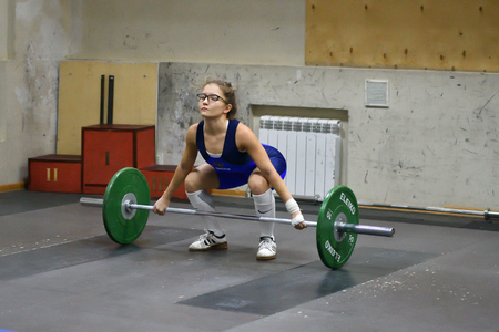 Orenburg, Russia, December 16, 2017 years: the girls compete in weightlifting at the Championship field on weightlifting and Cupのeditorial素材
