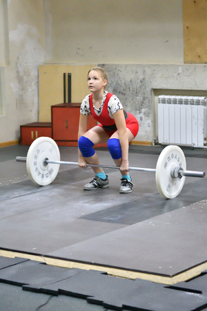 Orenburg, Russia, December 16, 2017 years: the girls compete in weightlifting at the Championship field on weightlifting and Cupのeditorial素材