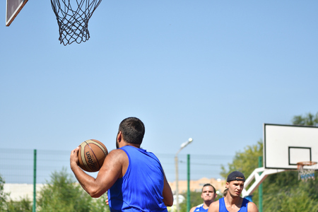 Orenburg, Russia - July 30, 2017 year: men play Street Basketball in the second round of the summer Street Basketball Leagueのeditorial素材
