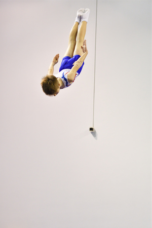 Orenburg, Russia - December 3, 2016: boys compete in jumping on the trampoline on competitions at the Orenburg region among Juniorsのeditorial素材