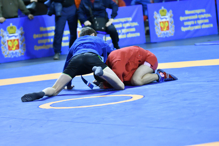 Orenburg, Russia - February 16, 2019: Boys competitions Self-defense without weapons in the Championship of the Orenburg region by Sambo among boys and girls born 2003-2004 biennium of birthのeditorial素材