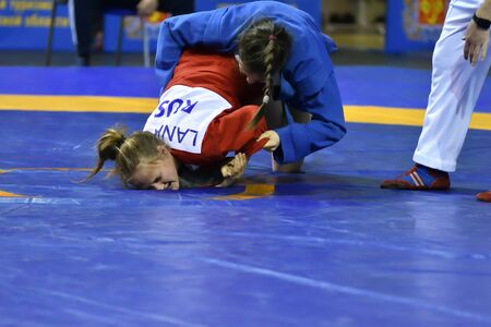 Orenburg, Russia - February 16, 2019: girls competitions Self-defense without weapons in the Championship of the Orenburg region by Sambo among boys and girls born 2003-2004 biennium of birthのeditorial素材