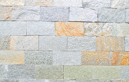 The texture of the building material from which the wall is built