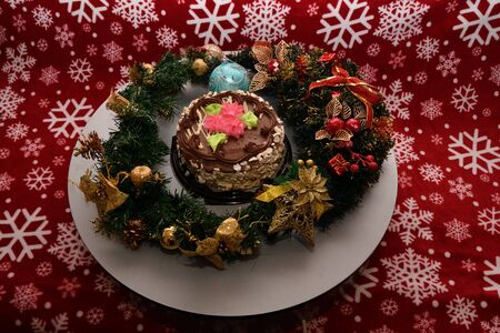 Christmas biscuit cake and colorful Christmas decorationの写真素材