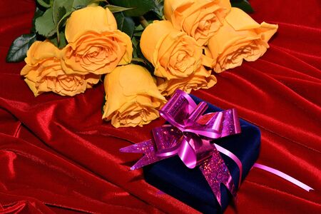 Yellow roses and gift in the Valentine's Dayの写真素材