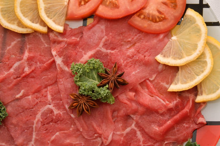 Carpaccio dish of thinly sliced pieces (slices) raw beef tenderloin