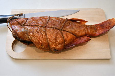 Wild Pacific sea bass (Latin Sebastes) or Pacific beak (Latin Sebastes alutus) hot smoked - Sea fish...