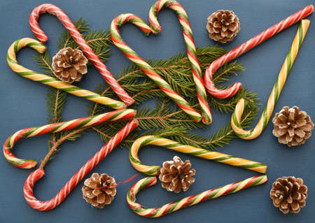 Christmas caramel or Christmas caramel canes, a branch of an ordinary spruce and fir conesの写真素材