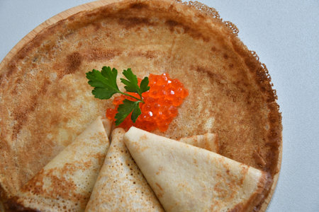 A treat with red caviar and fresh herbs for Orthodox Christmas