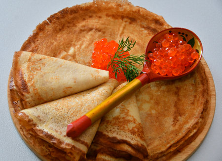Pancakes with red caviar, cooked for Maslenitsa. Maslenitsa is an East Slavic traditional holiday celebration during the week before Lent.の写真素材