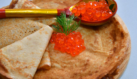 Pancakes with red caviar, cooked for Maslenitsa. Maslenitsa is an East Slavic traditional holiday celebration during the week before Lent.の写真素材