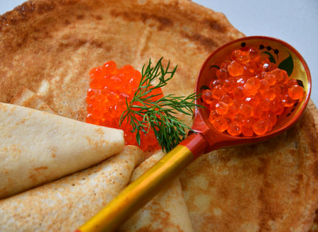 Pancakes with red caviar, cooked for Maslenitsa. Maslenitsa is an East Slavic traditional holiday celebration during the week before Lent.の写真素材