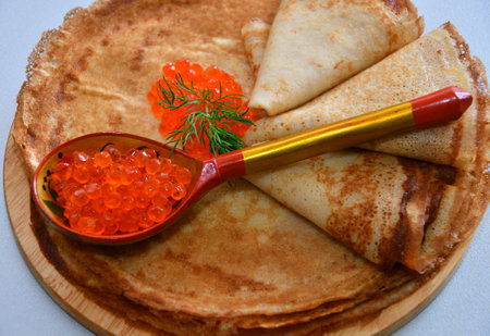 Pancakes with red caviar, cooked for Maslenitsa. Maslenitsa is an East Slavic traditional holiday celebration during the week before Lent.の写真素材