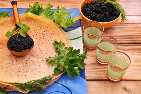 Pancakes with black caviar, cooked for Maslenitsa. Maslenitsa is an East Slavic traditional holiday celebration during the week before Lent.の写真素材