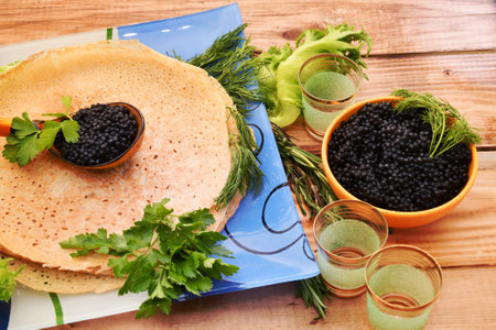 Pancakes with black caviar, cooked for Maslenitsa. Maslenitsa is an East Slavic traditional holiday celebration during the week before Lent.の写真素材