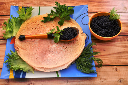 Pancakes with black caviar, cooked for Maslenitsa. Maslenitsa is an East Slavic traditional holiday celebration during the week before Lent.の写真素材