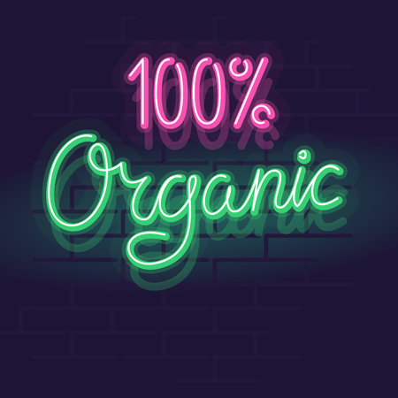 Neon 100% organic label for package, poster or web site. Isolated bright glowing handwritten text on brick wall backgroundのイラスト素材