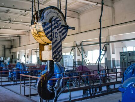 Industry. Metal hook with lifting cable mechanism. Close-up.の写真素材
