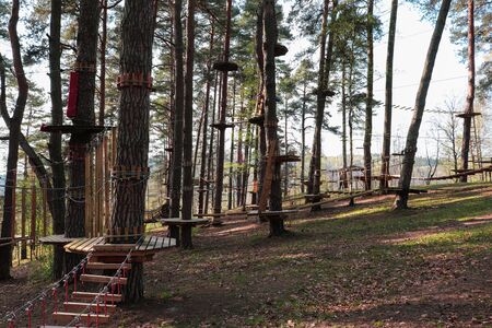 A bridge of logs tied to ropes, part of the rope route. Extreme sport.の写真素材