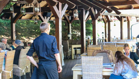 06-13-2020. Vilnius, Lithuania.  Wooden summer cafe in a city park.のeditorial素材