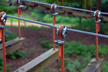 Rope holding a log bridge, part of the cableway. Close-up. Extreme sport.