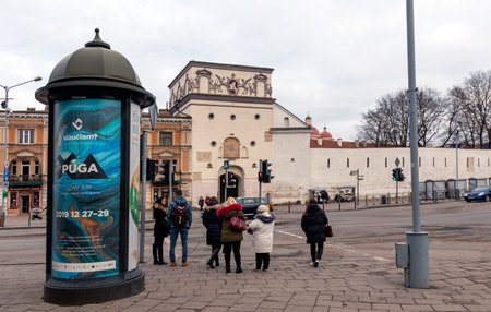 12-19-2019. Vilnius, Lithuania. A group of people near the city wall in the old part of the city.のeditorial素材