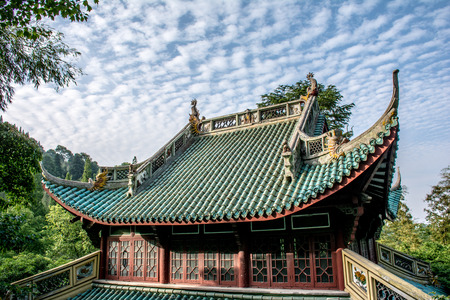 China architecture, Oriental-style house. Roof with dragons and blue tiles on the background of the sky. Traditional Chinese house with curved roofのeditorial素材