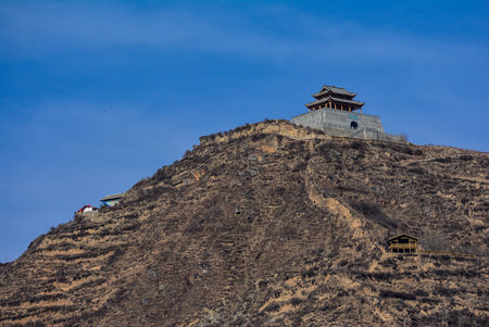 House on a mountain on a background of the sky in the Chinese style. The structure at the top of a...