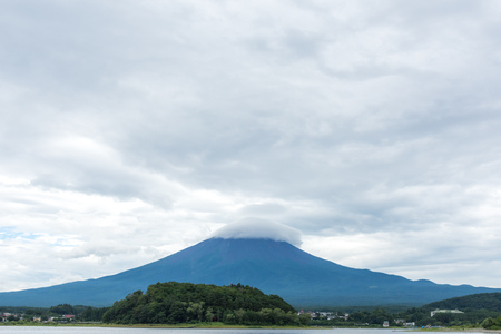 View of the Fuji mountain from the shore of the pond. Japanの写真素材