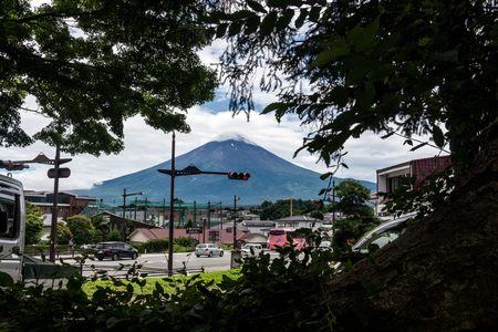 View of the mountain of Fuji through trees and city. Japanの写真素材