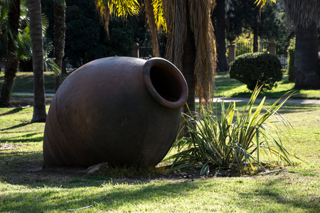 Sightseeing of the city of Valencia in the background of the park, Spain. Sculpture of a pot of clay in the parkの写真素材