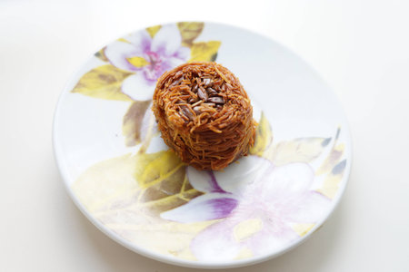 East sweets on a small saucer kunafa