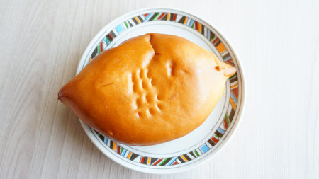 Patties in the form of a fish on a plate.