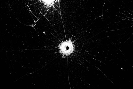 glass in cracks on a black background.の写真素材