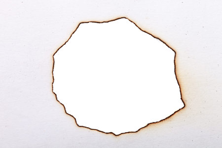 charred paper. centered isolated on a white backgroundの写真素材