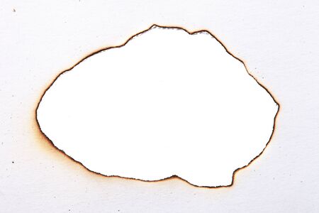 charred paper. centered isolated on a white backgroundの写真素材