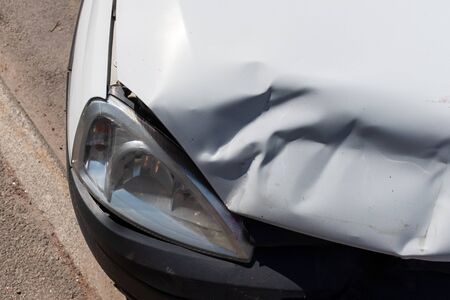 car after an accident. damage to the hood with headlight. High quality photoの写真素材