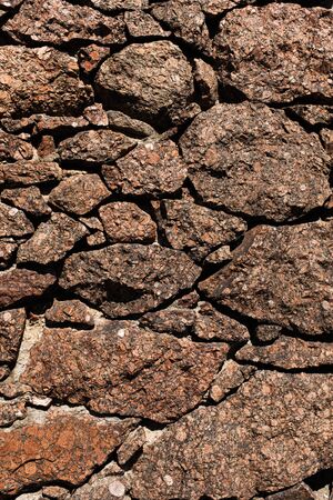 stone wall made of natural granite boulders. High quality photoの写真素材