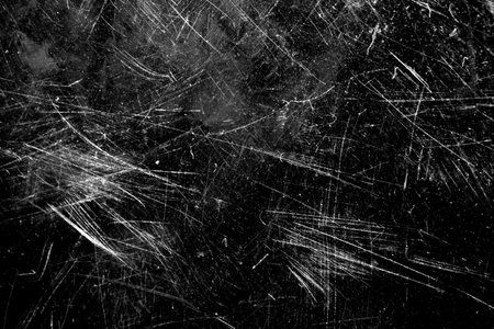 on a black background glass with white scratches and spots.