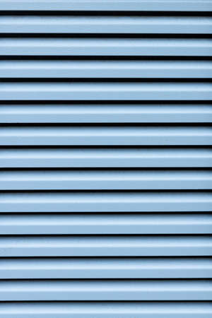 metal blue plate with ventilation holes. background for designer. High quality photoの写真素材
