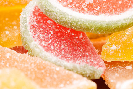 a bunch of colored marmalade with sugar.