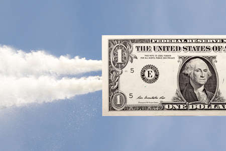 a dollar flying into the sky.の写真素材