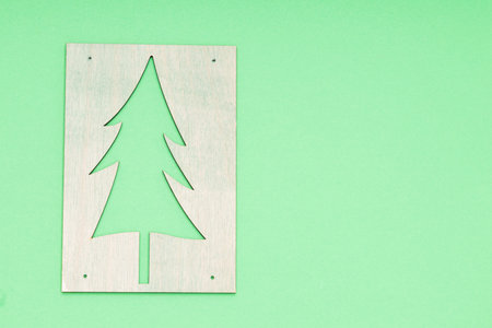 wooden pattern of a Christmas tree on a greenの写真素材