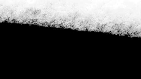 strip of snow isolated on a blackの写真素材