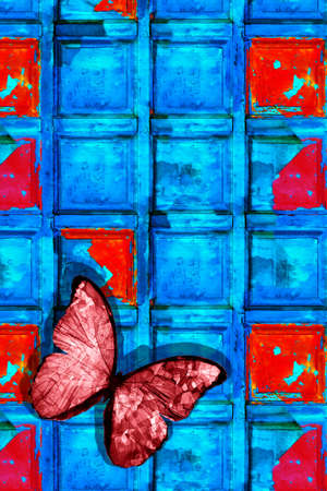 Beautiful red butterfly on a beautiful blue wall with red spots. vertical frame. High quality photoの写真素材